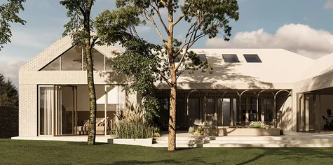 A modern white brick house with a gable roof, covered terraces and large trees in the yard, in an English countryside village. Soft light and natural lighting.