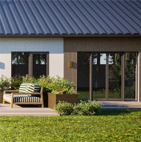 A close-up view of a patio area with contemporary outdoor furniture, including a striped cushioned chair and large planters filled with greenery, situated against a backdrop of a modern house with vertical wooden detailing.